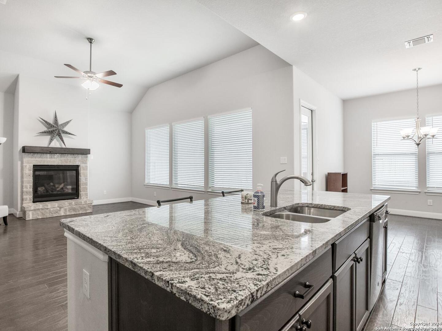 113 Giverny Boerne, TX 78006 - Photo 1 of 1 a kitchen with center island a sink appliances and a counter space