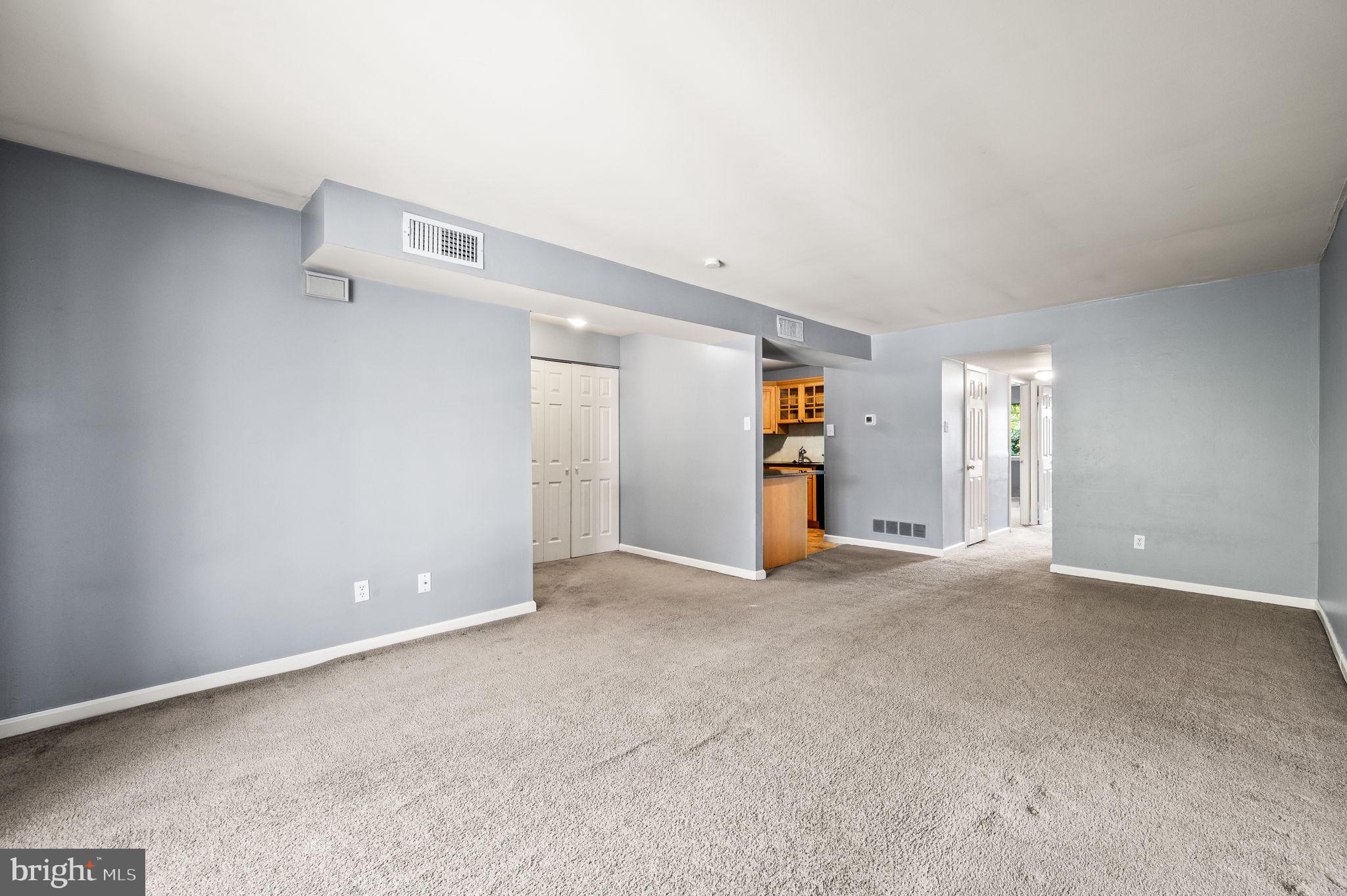 830 Putnam Boulevard, Unit B Wallingford, PA 19086 - Photo 4 of 14 an empty room with closet and windows