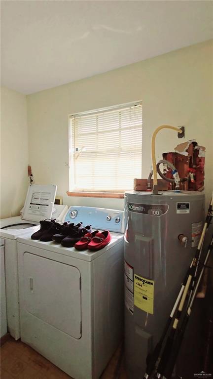 106 Rosa Priego Street Donna, TX 78537 - Photo 18 of 25 Clothes washing area featuring deep freex machine and electric panel