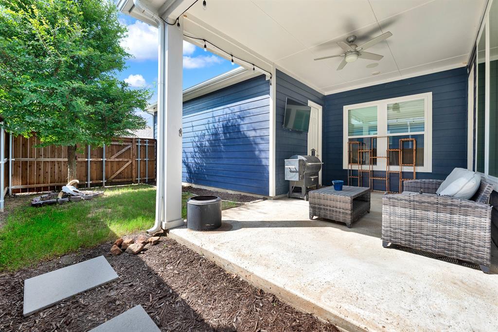 6404 Trezevant Street Rowlett, TX 75089 - Photo 26 of 30 a view of a house with backyard and a garden