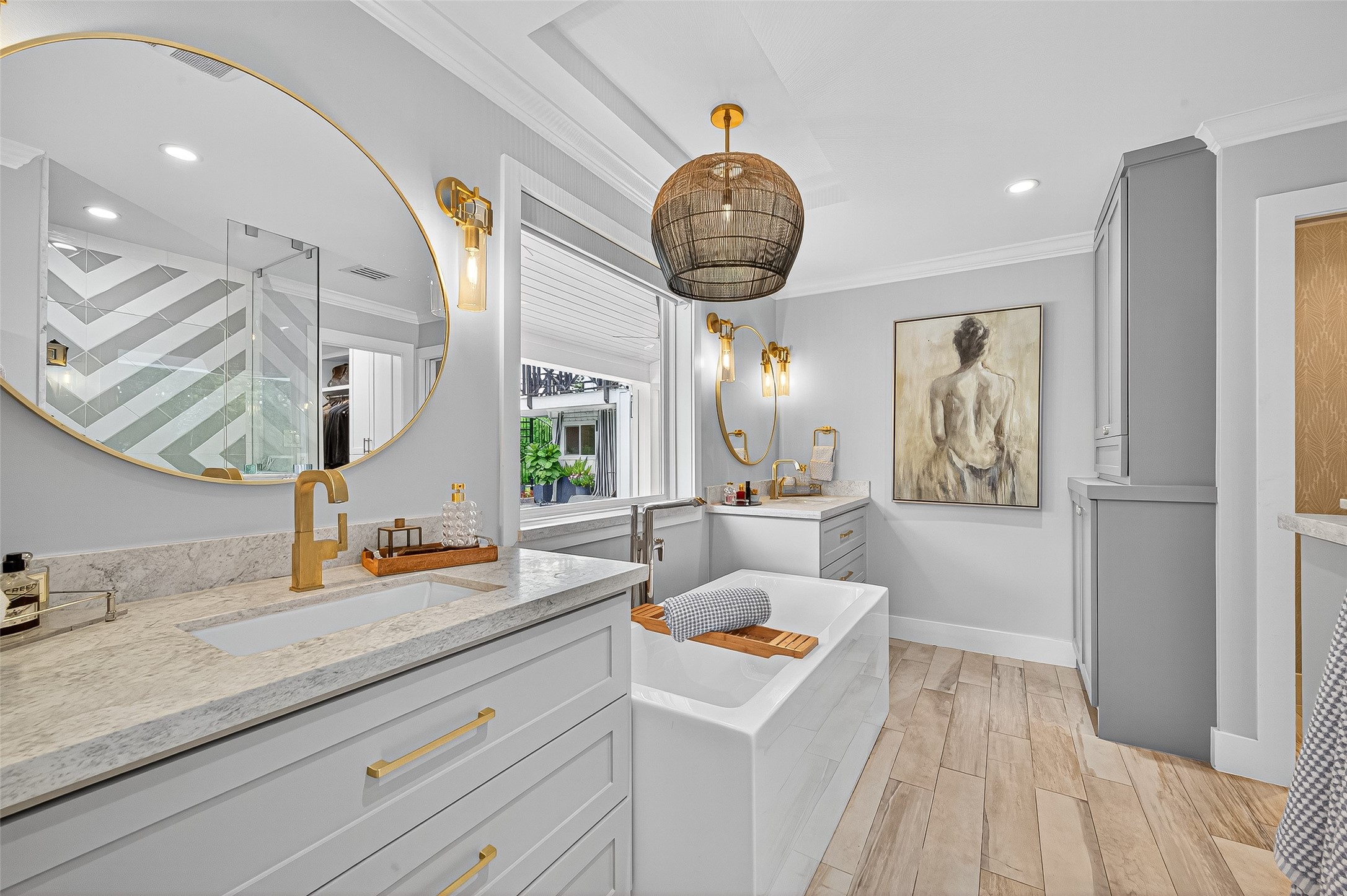 415 Ramblewood Road Houston, TX 77079 - Photo 21 of 49 Ensuite primary bathroom has double sinks, soaking tub, and separate shower.