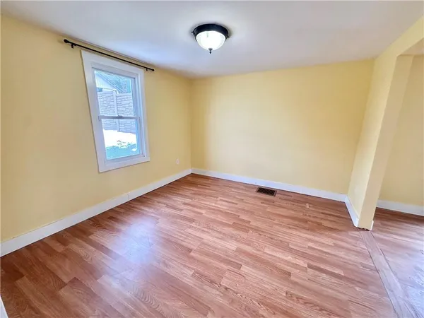 a dining room with a table and chairs