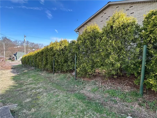 a house view with a garden space