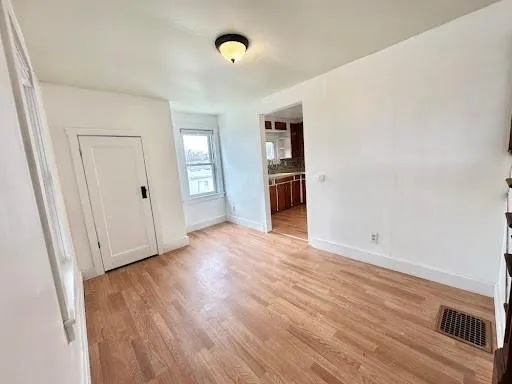 a bedroom with a bed and a rug