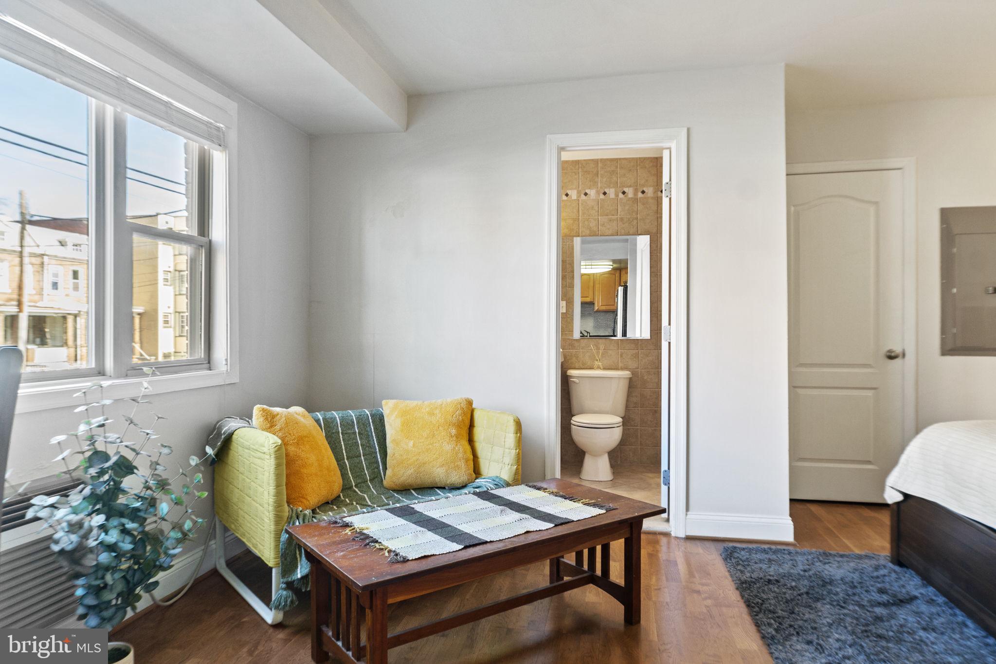 738 Longfellow Street Northwest, Unit 209 Washington, DC 20011 - Photo 8 of 21 Living to bathroom