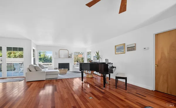 a view of a livingroom with furniture and a fireplace