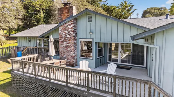 a view of a house with porch and furniture