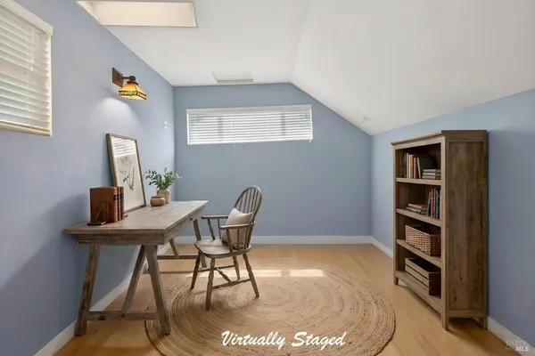 a workspace with furniture and window
