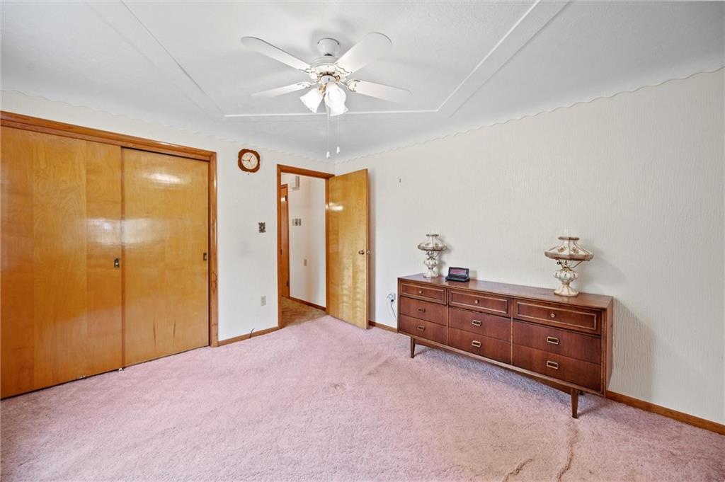 3332 Jacks Run Road North Versailles, PA 15137 - Photo 20 of 30 a bed room with a bed and a chandelier