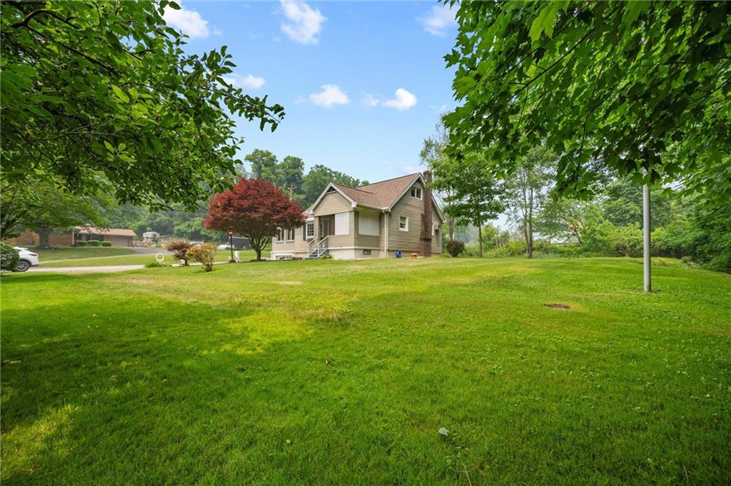 3332 Jacks Run Road North Versailles, PA 15137 - Photo 5 of 30 a front view of a house with garden