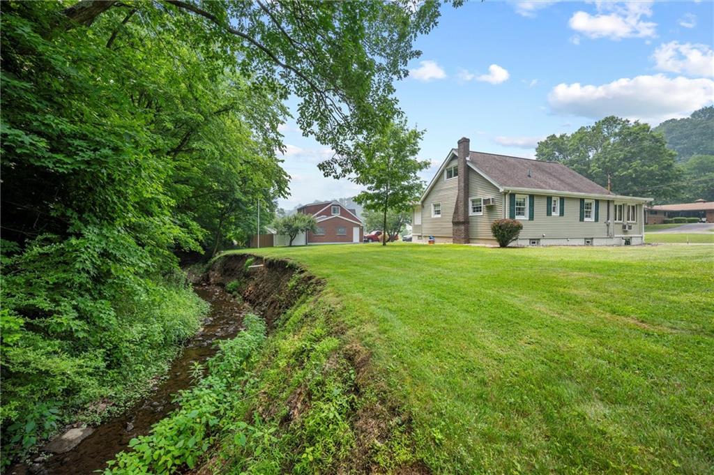 3332 Jacks Run Road North Versailles, PA 15137 - Photo 6 of 30 a front view of a house with a yard