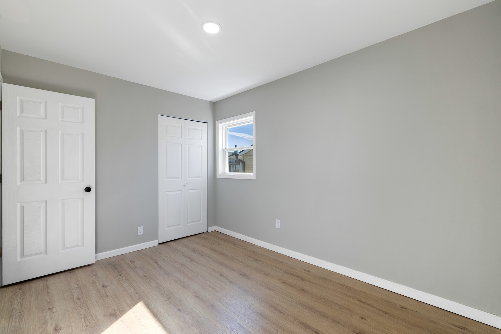 222 Pell Avenue Romeoville, IL 60446 - Photo 11 of 27 a view of an empty room with wooden floor and closet