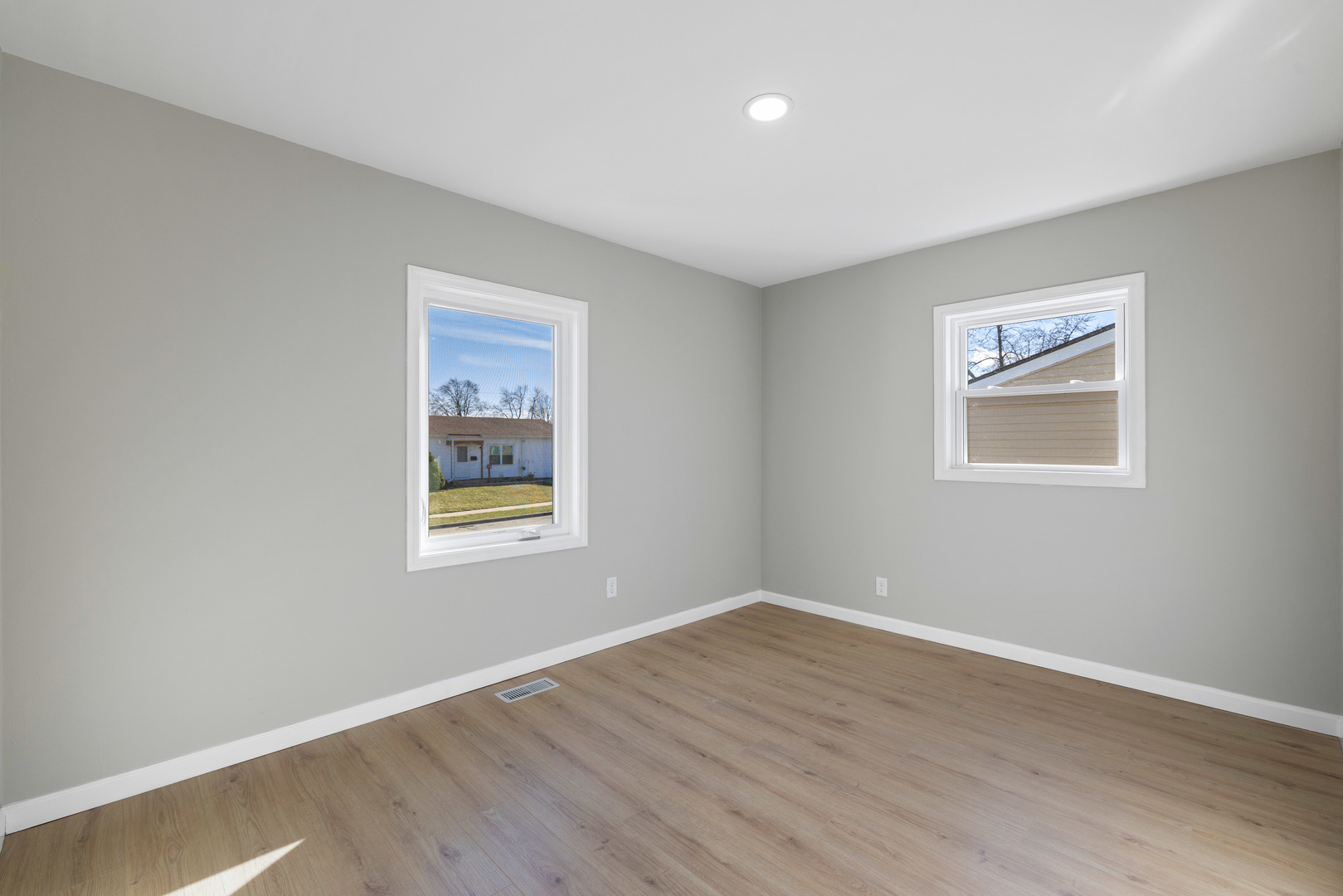 222 Pell Avenue Romeoville, IL 60446 - Photo 13 of 27 a view of an empty room with wooden floor and a window