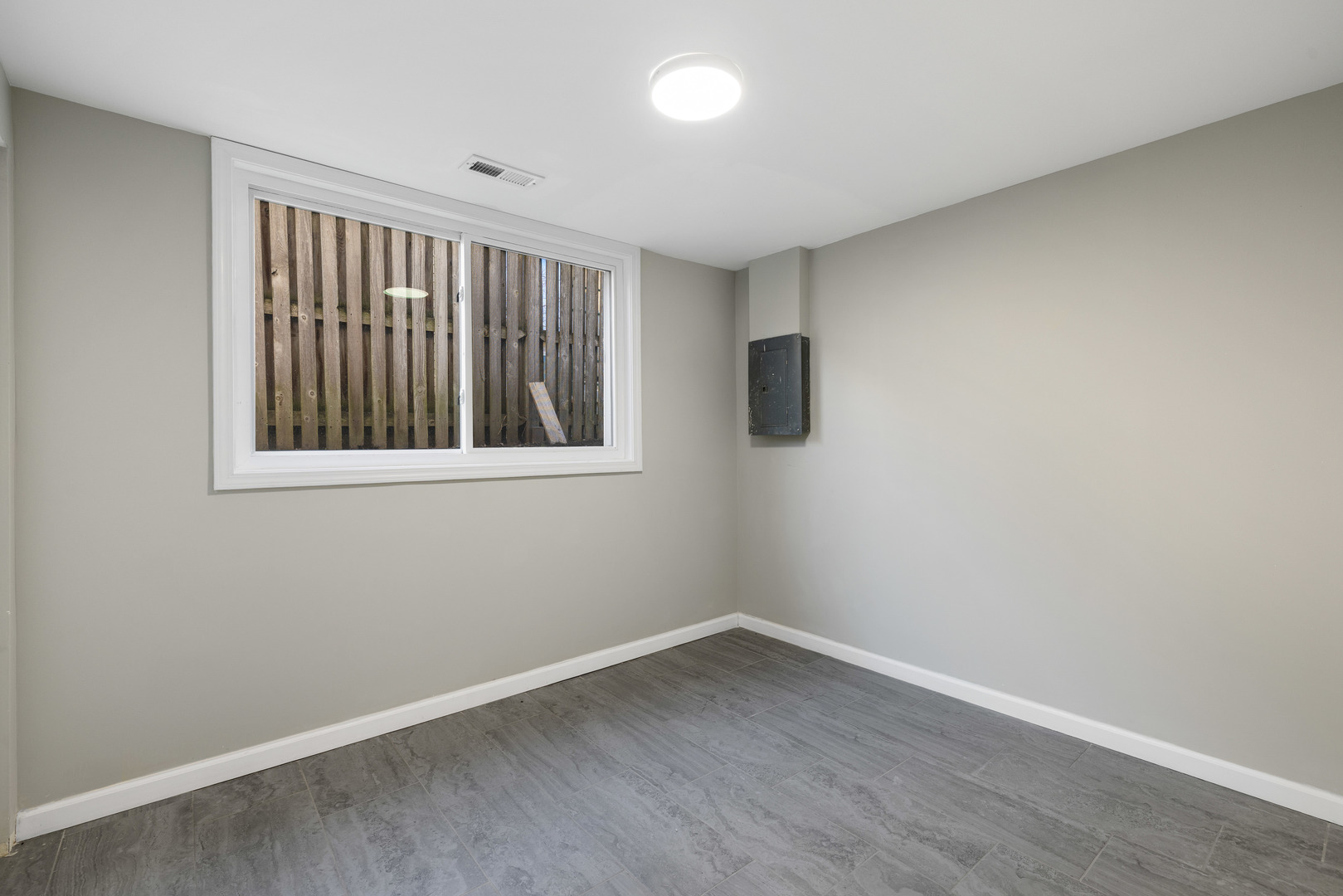 222 Pell Avenue Romeoville, IL 60446 - Photo 18 of 27 a view of an empty room with wooden floor and a window