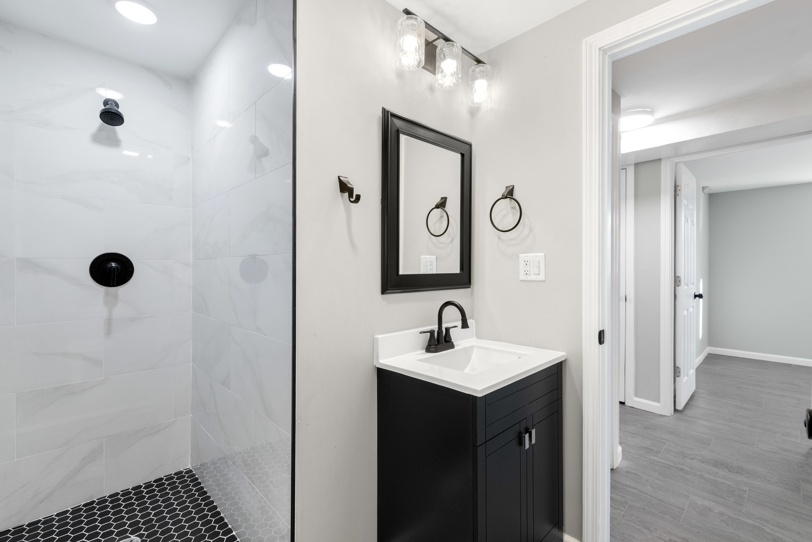 222 Pell Avenue Romeoville, IL 60446 - Photo 20 of 27 a bathroom with a double vanity sink a mirror and a shower