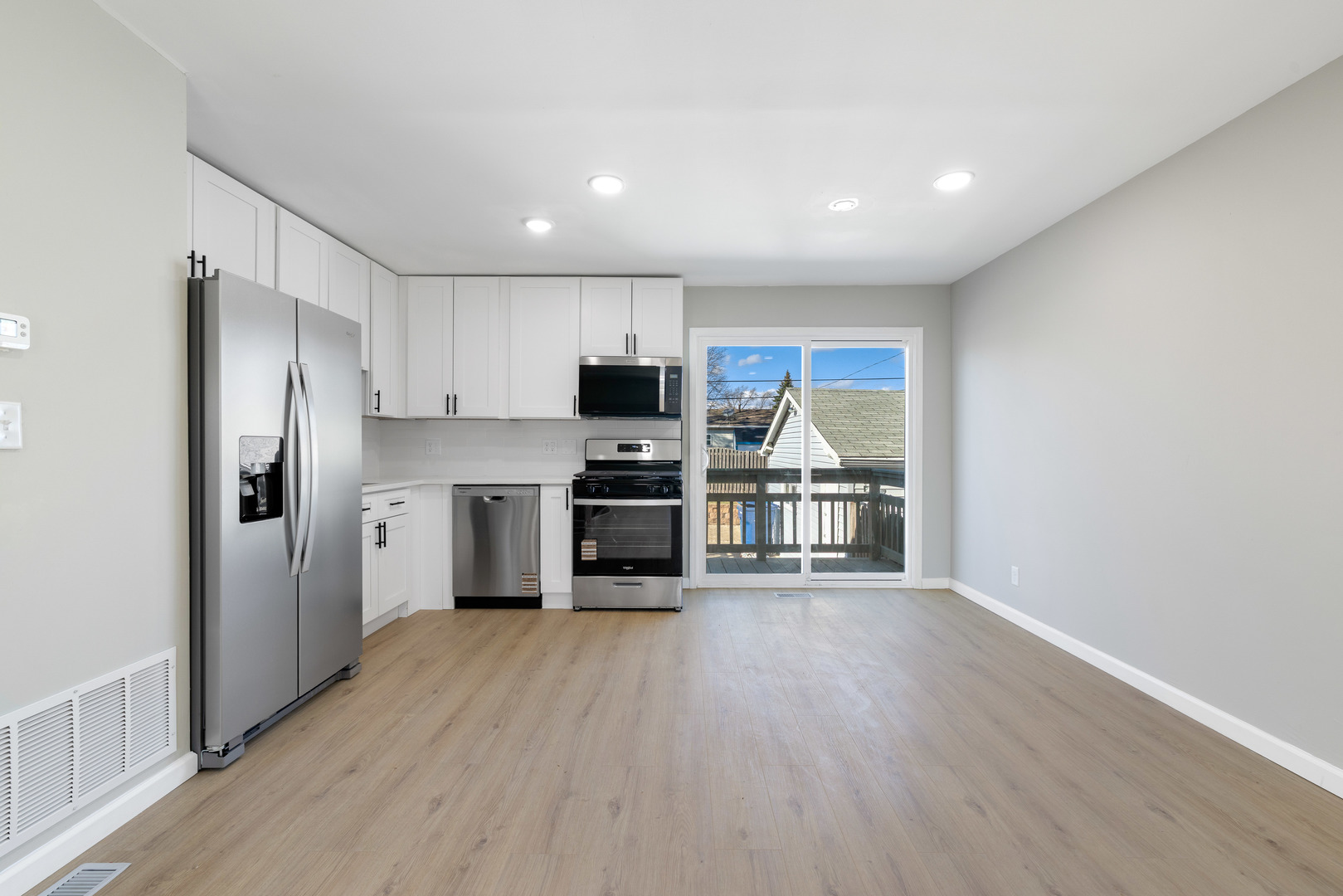 222 Pell Avenue Romeoville, IL 60446 - Photo 6 of 27 a kitchen with stainless steel appliances a refrigerator and a stove top oven