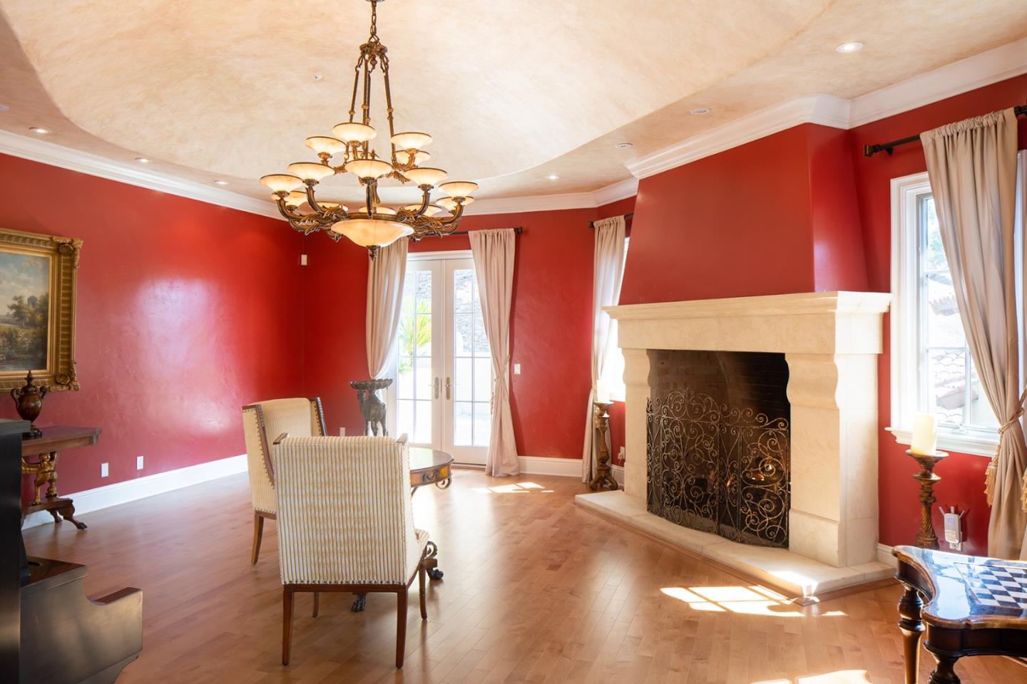 14501 Roland Canyon Road Salinas, CA 93908 - Photo 13 of 53 a dining room with furniture a fireplace and chandelier
