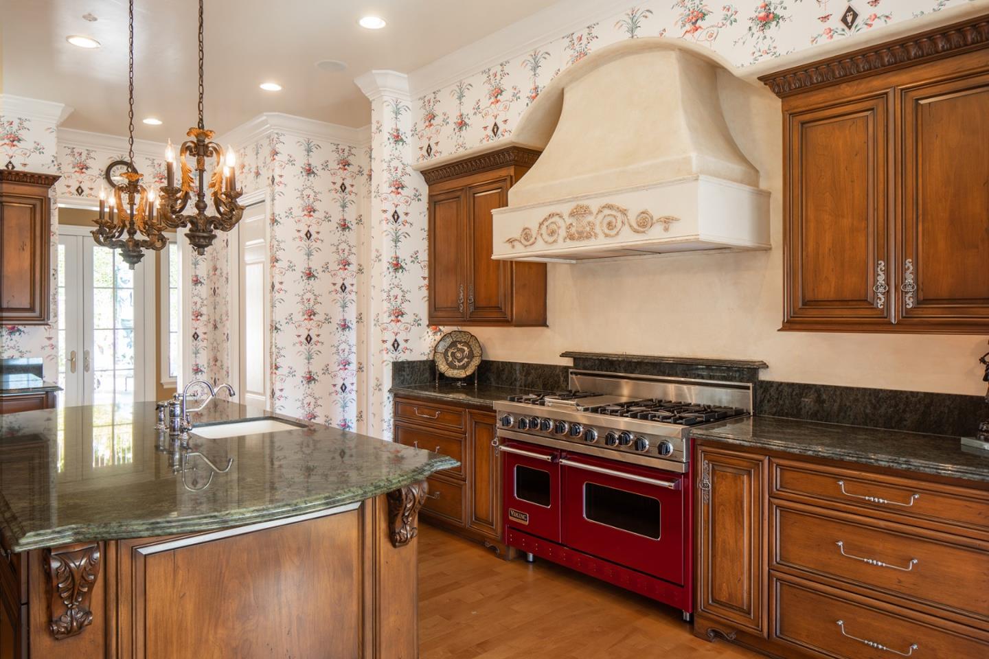 14501 Roland Canyon Road Salinas, CA 93908 - Photo 19 of 53 a kitchen with stainless steel appliances granite countertop a stove a sink and a microwave