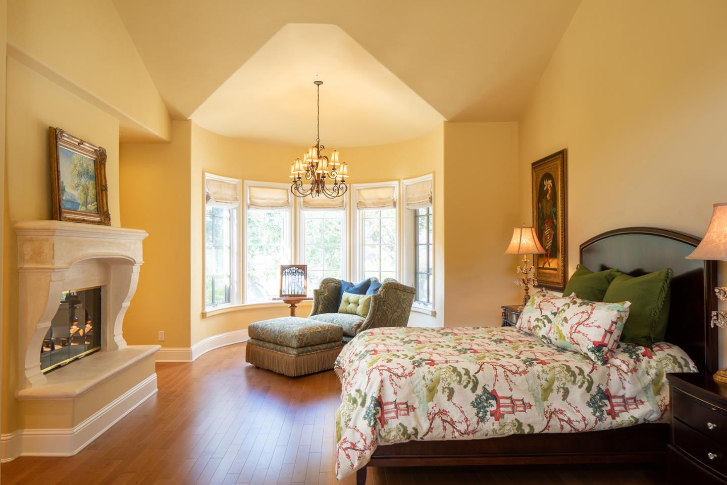 14501 Roland Canyon Road Salinas, CA 93908 - Photo 22 of 53 a bed room with a bed and a chandelier