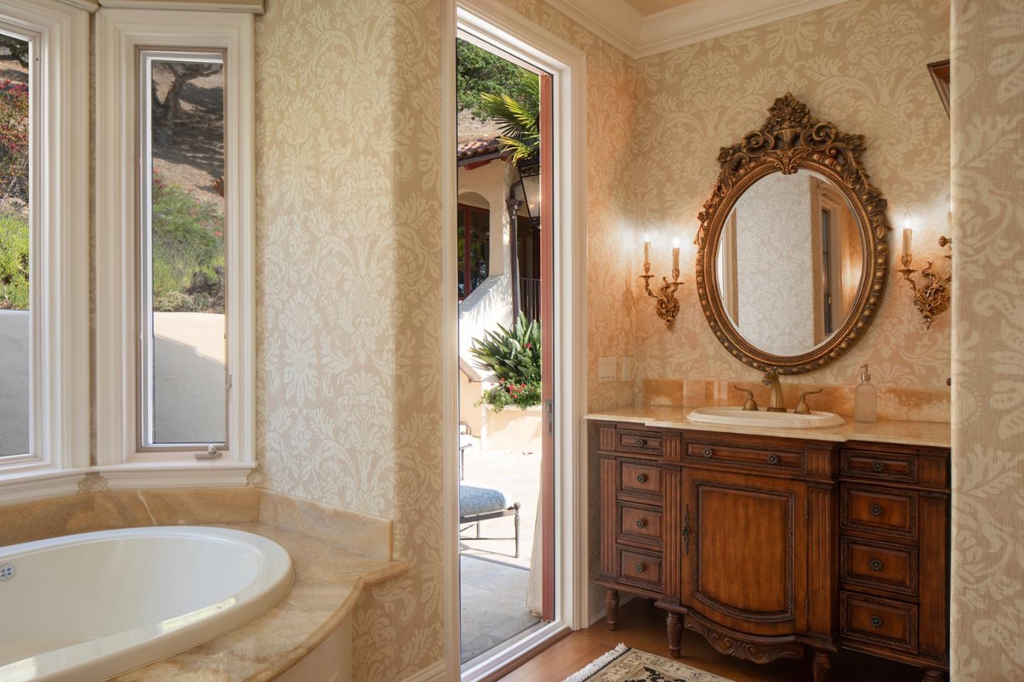 14501 Roland Canyon Road Salinas, CA 93908 - Photo 25 of 53 a bathroom with a sink and a mirror