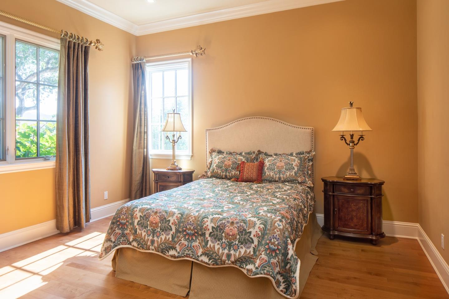 14501 Roland Canyon Road Salinas, CA 93908 - Photo 27 of 53 a bedroom with a bed and wooden floor