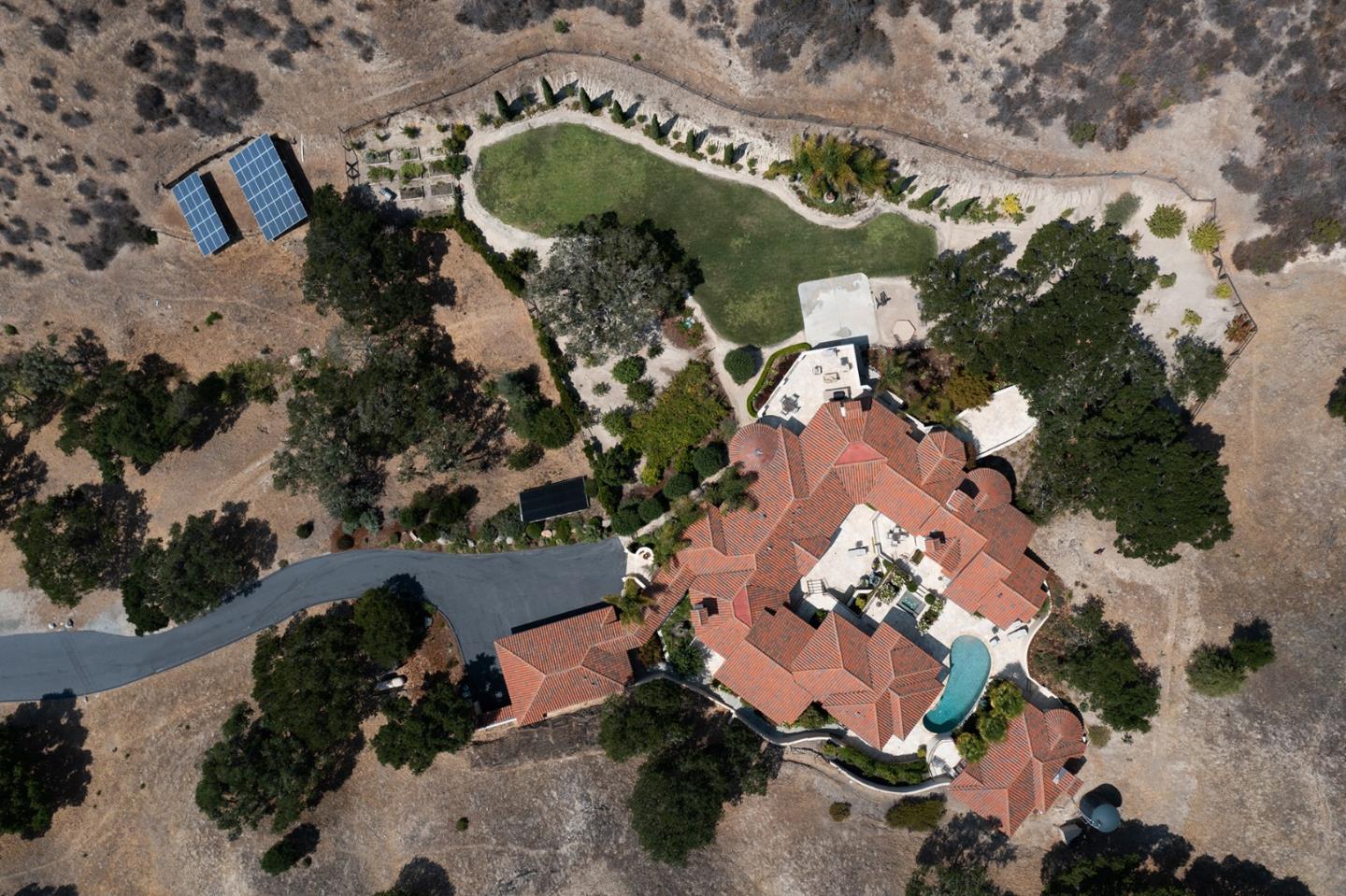 14501 Roland Canyon Road Salinas, CA 93908 - Photo 5 of 53 an aerial view of a house with a yard and tennis court