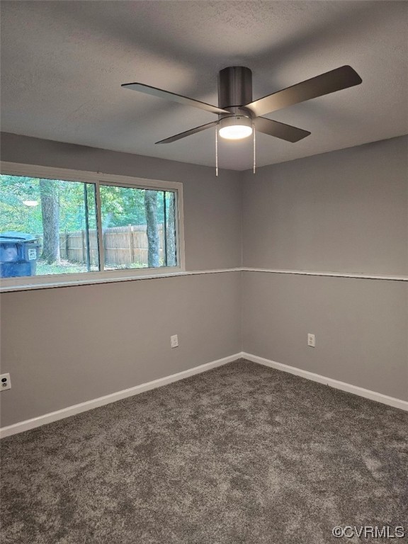 9400 Kendrick Road Chesterfield, VA 23236 - Photo 4 of 10 an empty room with windows and ceiling fan