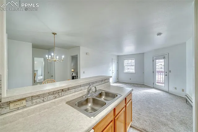 a bathroom with a granite countertop sink a large mirror and a bathtub