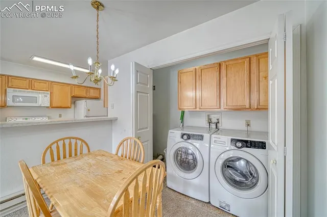 a view of a kitchen with a sink dishwasher and washer