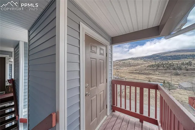 a view of a balcony with wooden floor
