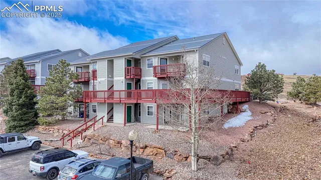 a aerial view of a houses with a yard