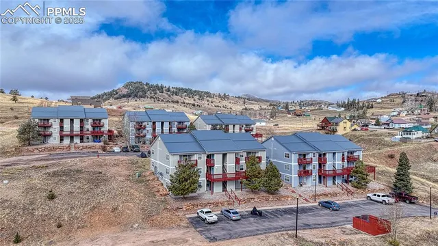 an aerial view of a houses with yard