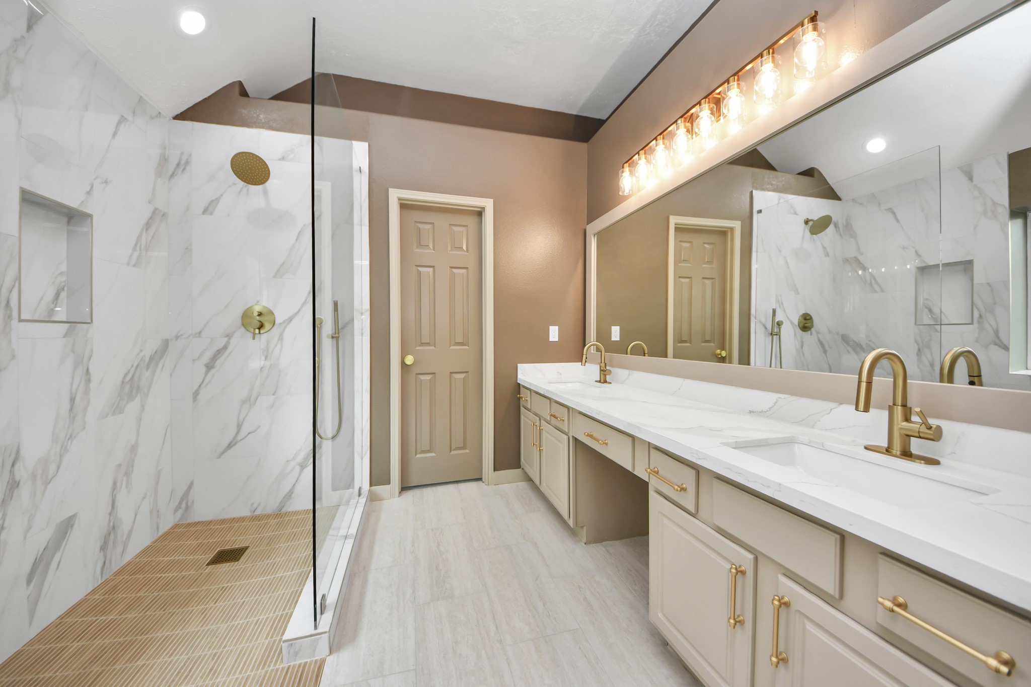 14423 Gadwall Court Houston, TX 77044 - Photo 32 of 42 a bathroom with a granite countertop sink a large mirror and shower