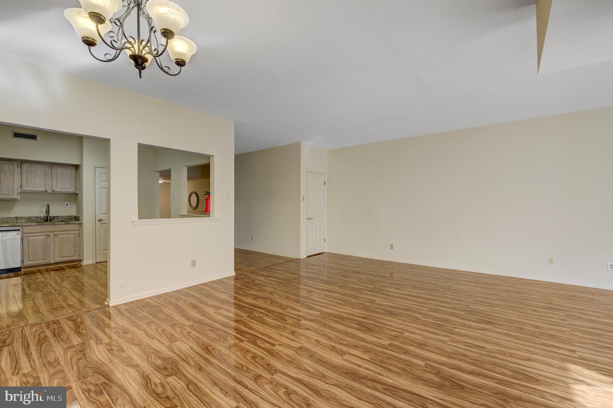 6146 Main Street Voorhees, NJ 08043 - Photo 13 of 40 a view of empty room with wooden floor