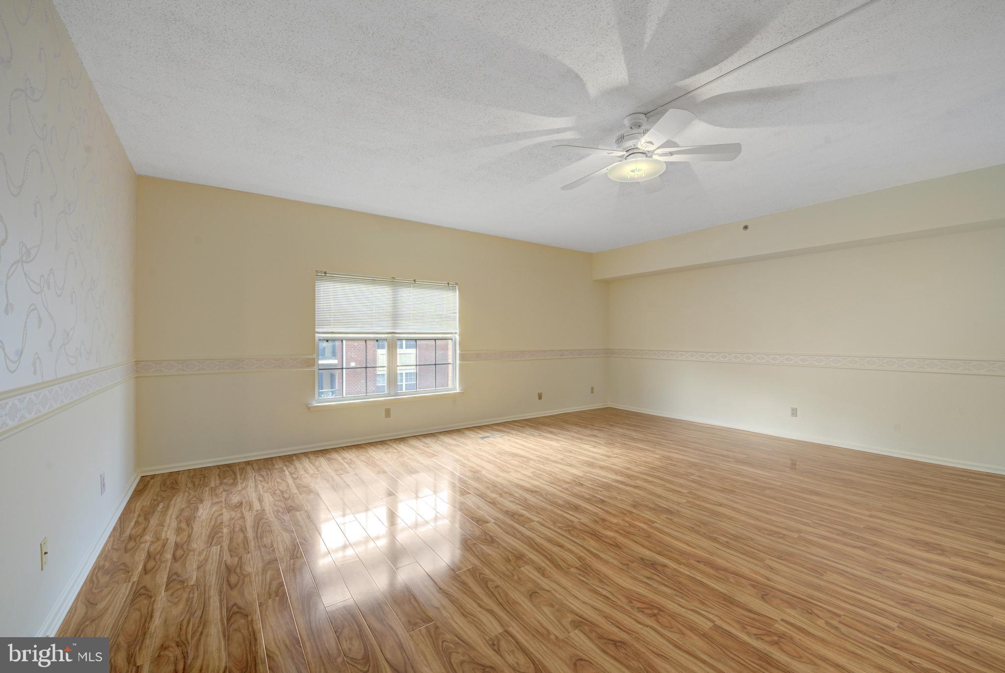 6146 Main Street Voorhees, NJ 08043 - Photo 17 of 40 wooden floor in an empty room with a window