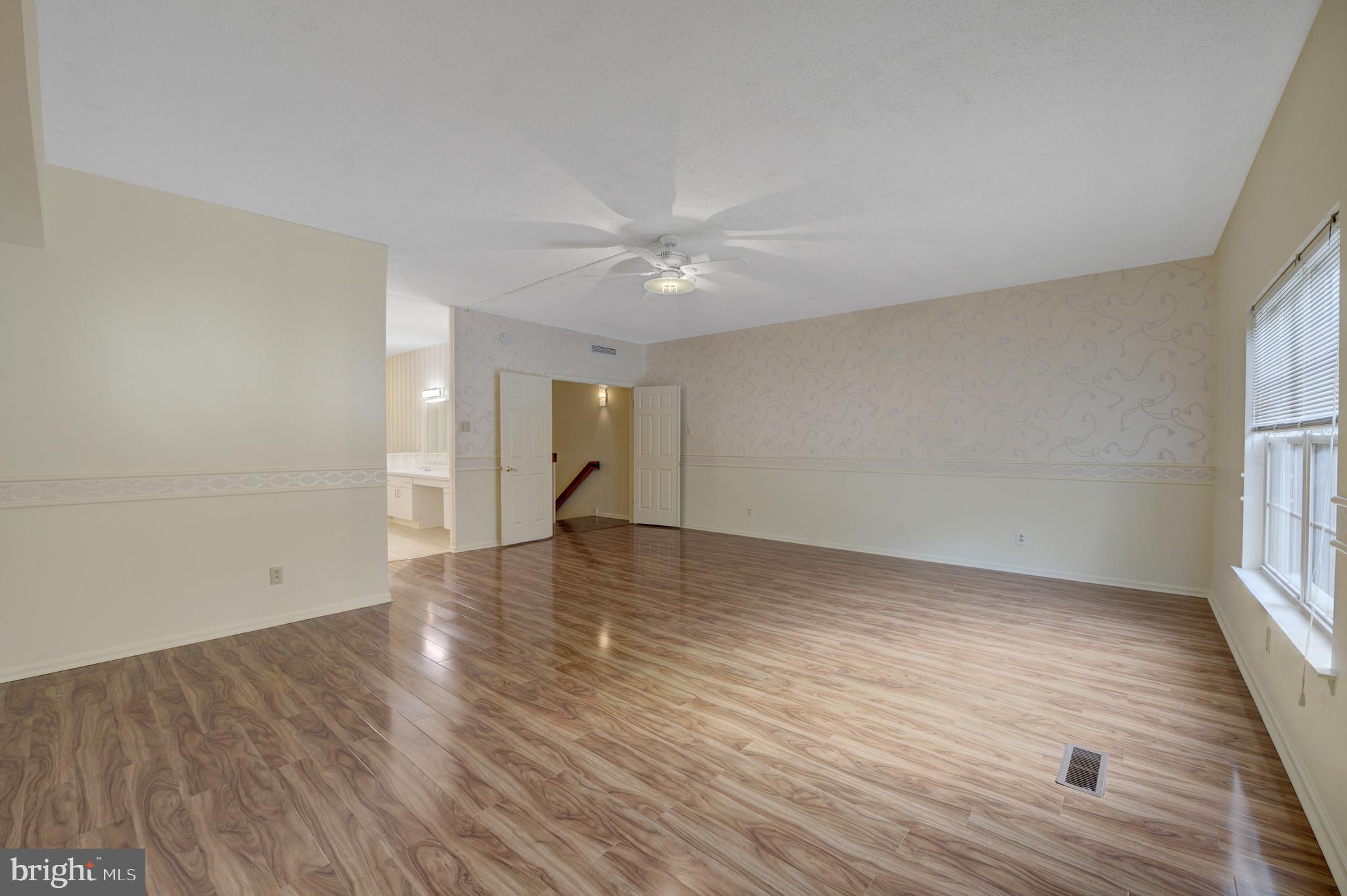 6146 Main Street Voorhees, NJ 08043 - Photo 19 of 40 wooden floor in an empty room with a window