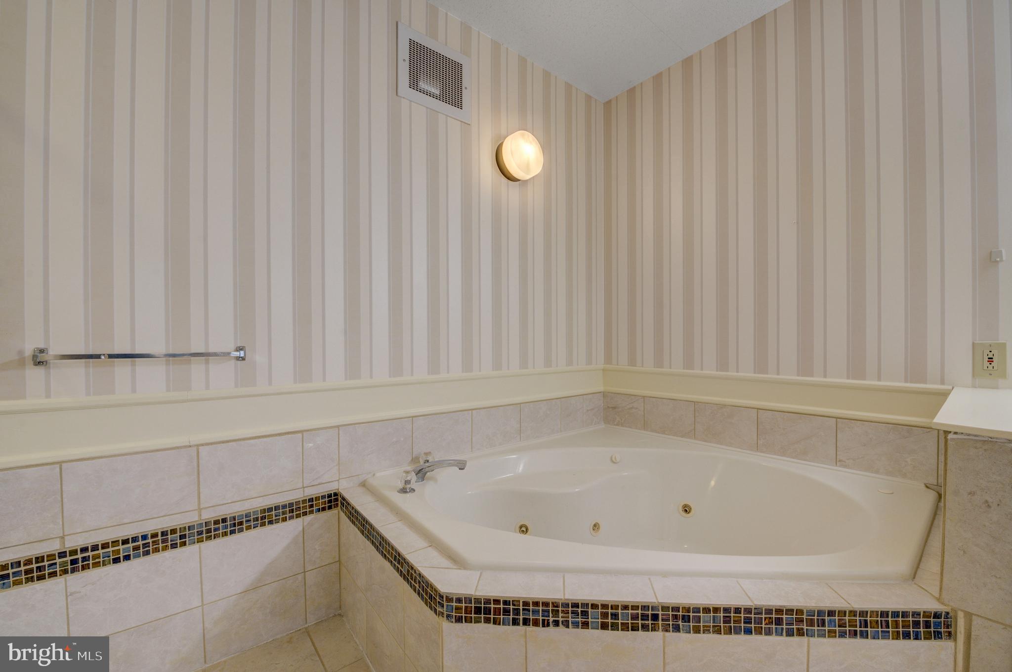 6146 Main Street Voorhees, NJ 08043 - Photo 23 of 40 a bathroom with a bathtub and shower
