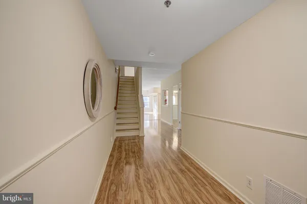 a view of a livingroom with wooden floor