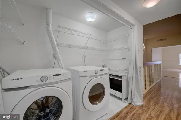 a view of livingroom with washer and dryer
