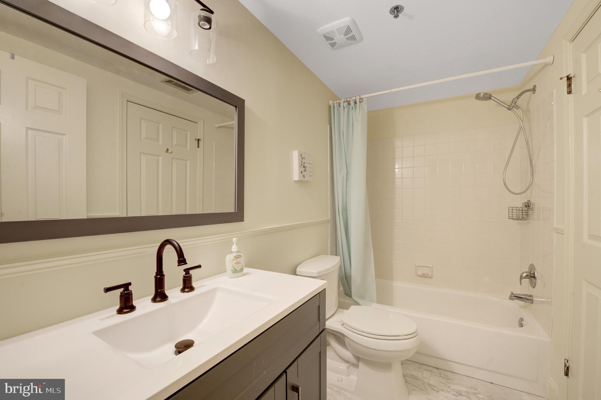 6146 Main Street Voorhees, NJ 08043 - Photo 7 of 40 a bathroom with a sink toilet and shower