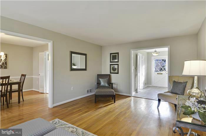 8723 Postoak Road Rockville, MD 20854 - Photo 13 of 30 Living Room open to Dining Room
