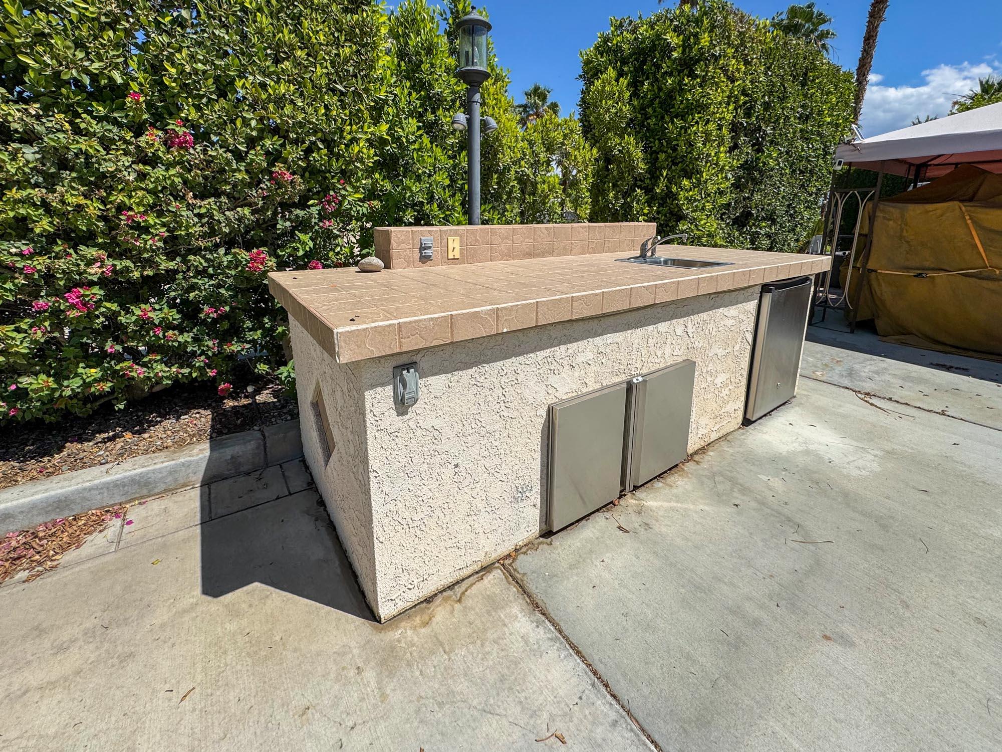a view of a backyard with jacuzzi