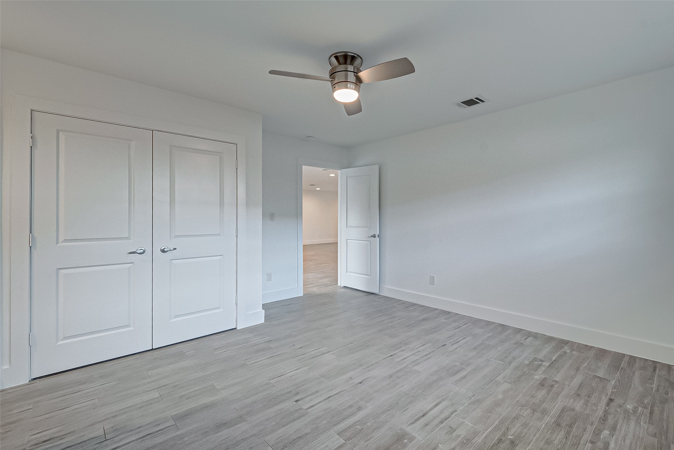 5007 Cheena Drive Houston, TX 77096 - Photo 20 of 40 a view of an empty room and wooden floor