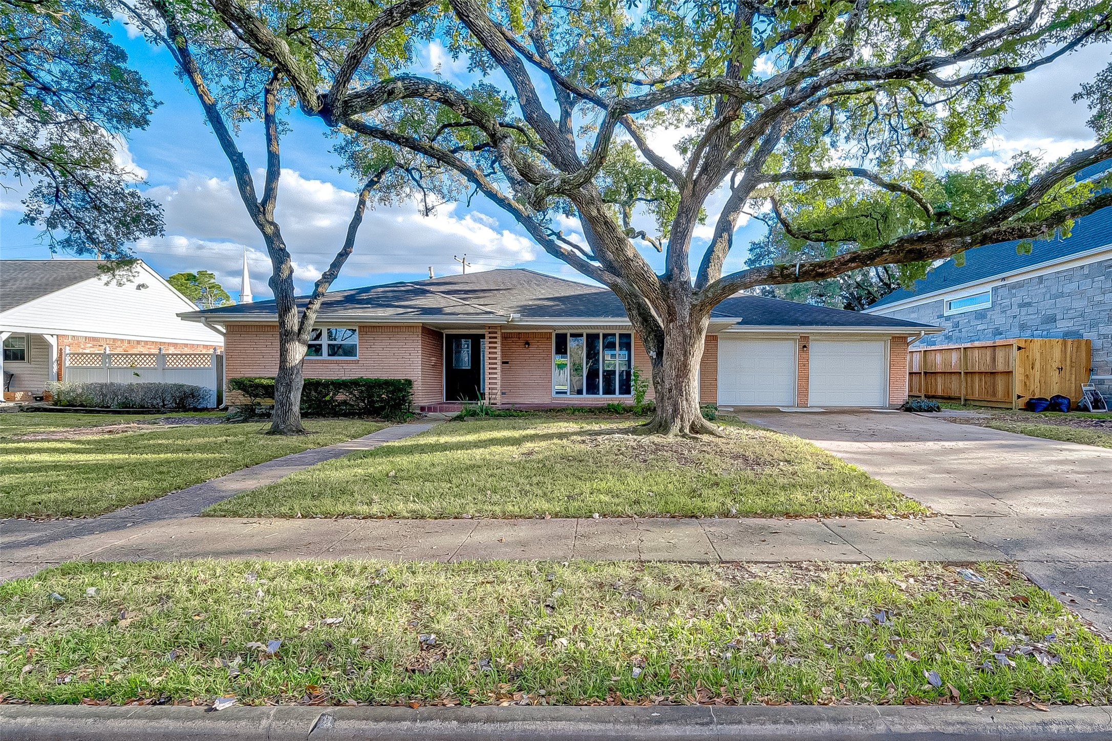 5007 Cheena Drive Houston, TX 77096 - Photo 2 of 40 a house view with a garden space