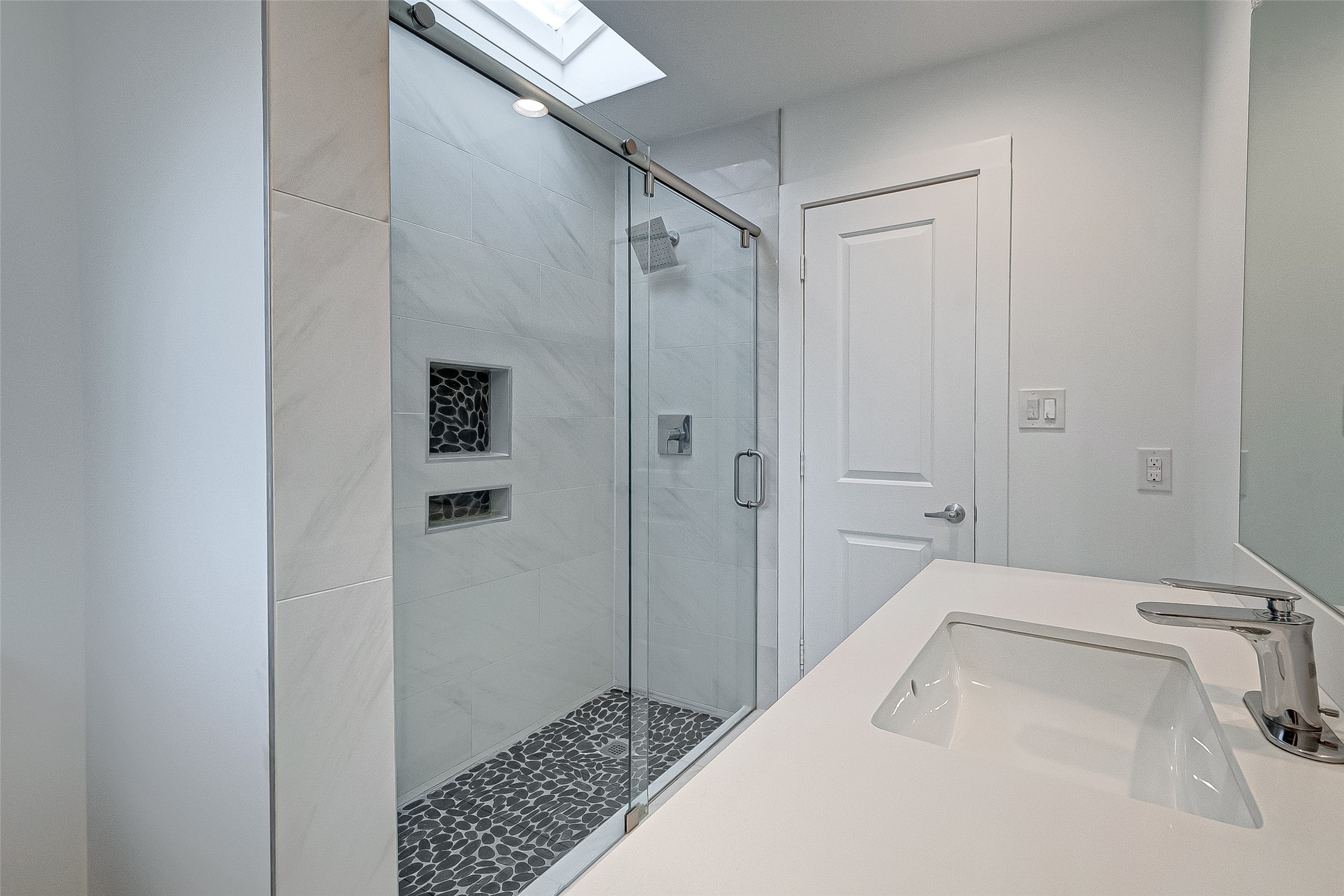 5007 Cheena Drive Houston, TX 77096 - Photo 25 of 40 a bathroom with a sink and shower