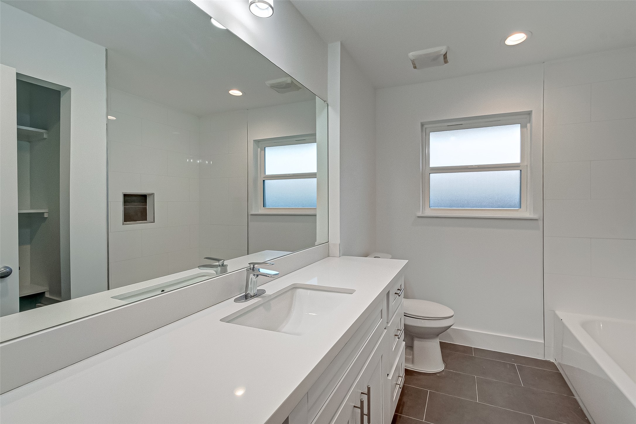 5007 Cheena Drive Houston, TX 77096 - Photo 29 of 40 a bathroom with a sink and a mirror