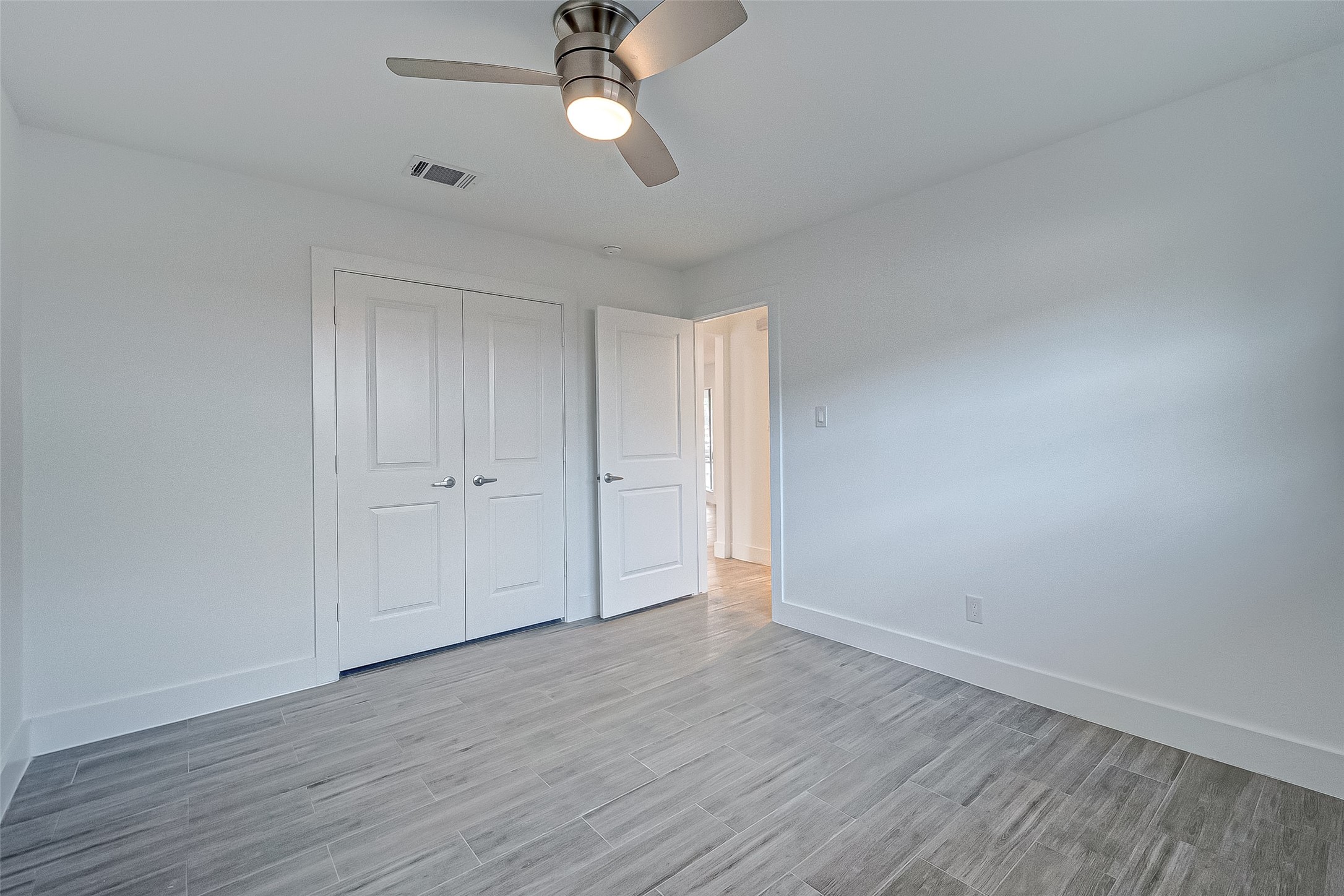 5007 Cheena Drive Houston, TX 77096 - Photo 31 of 40 a view of an empty room with wooden floor