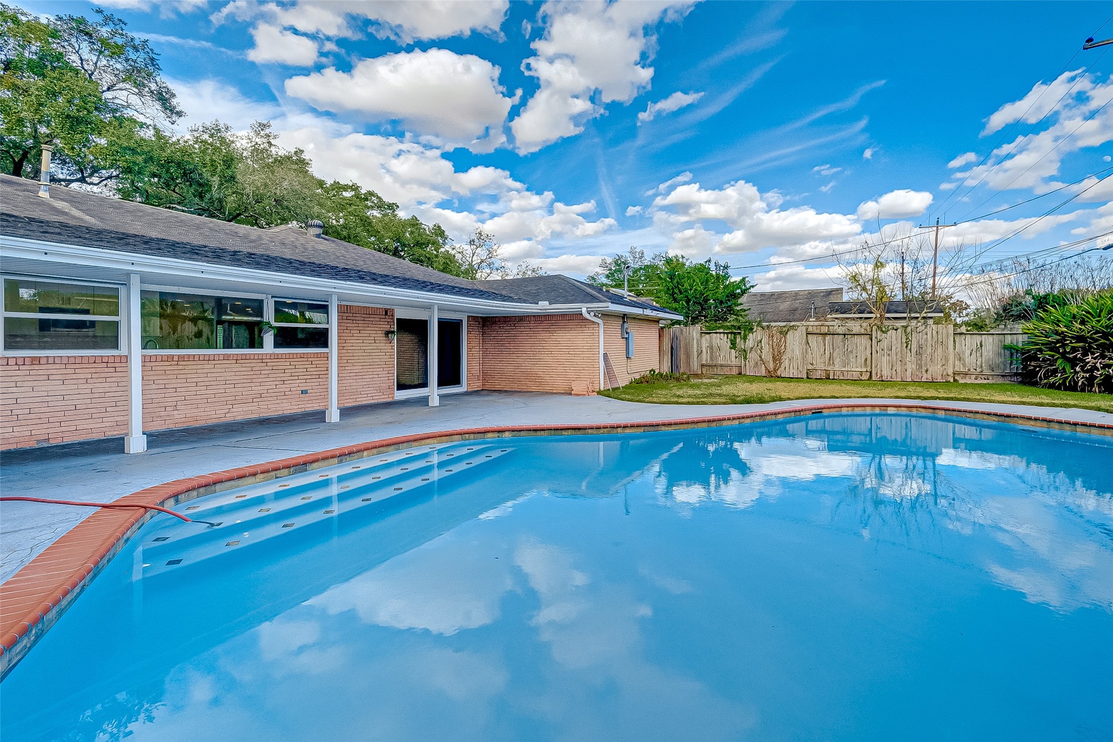 5007 Cheena Drive Houston, TX 77096 - Photo 35 of 40 a view of a house with swimming pool