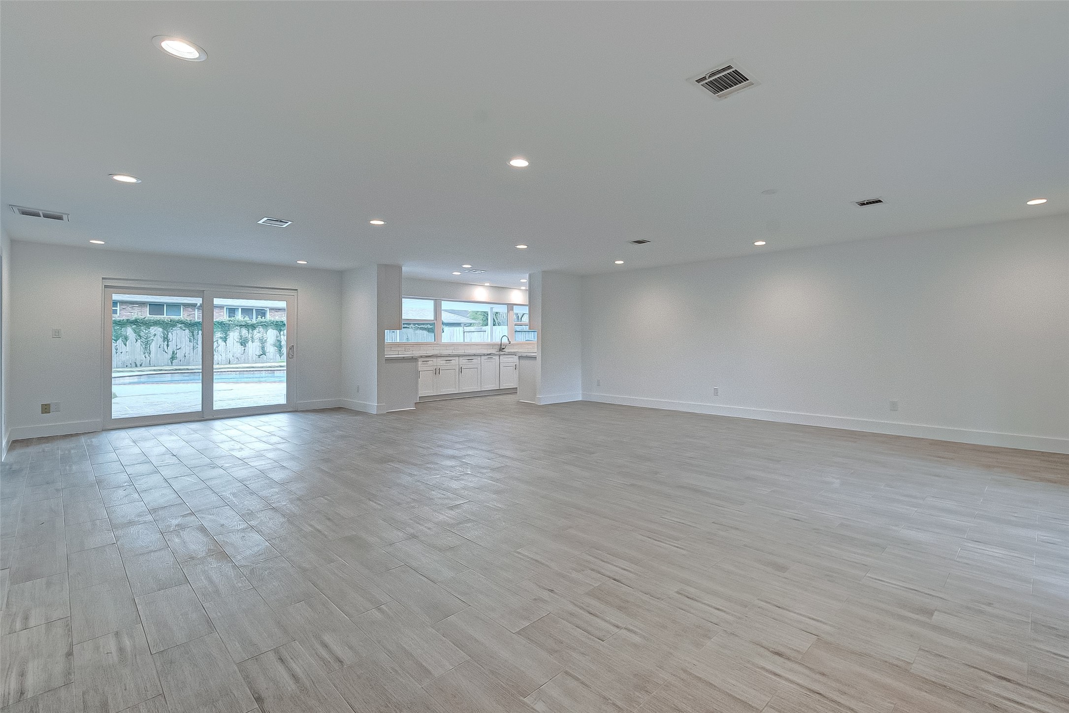 5007 Cheena Drive Houston, TX 77096 - Photo 7 of 40 an empty room with wooden floor and windows