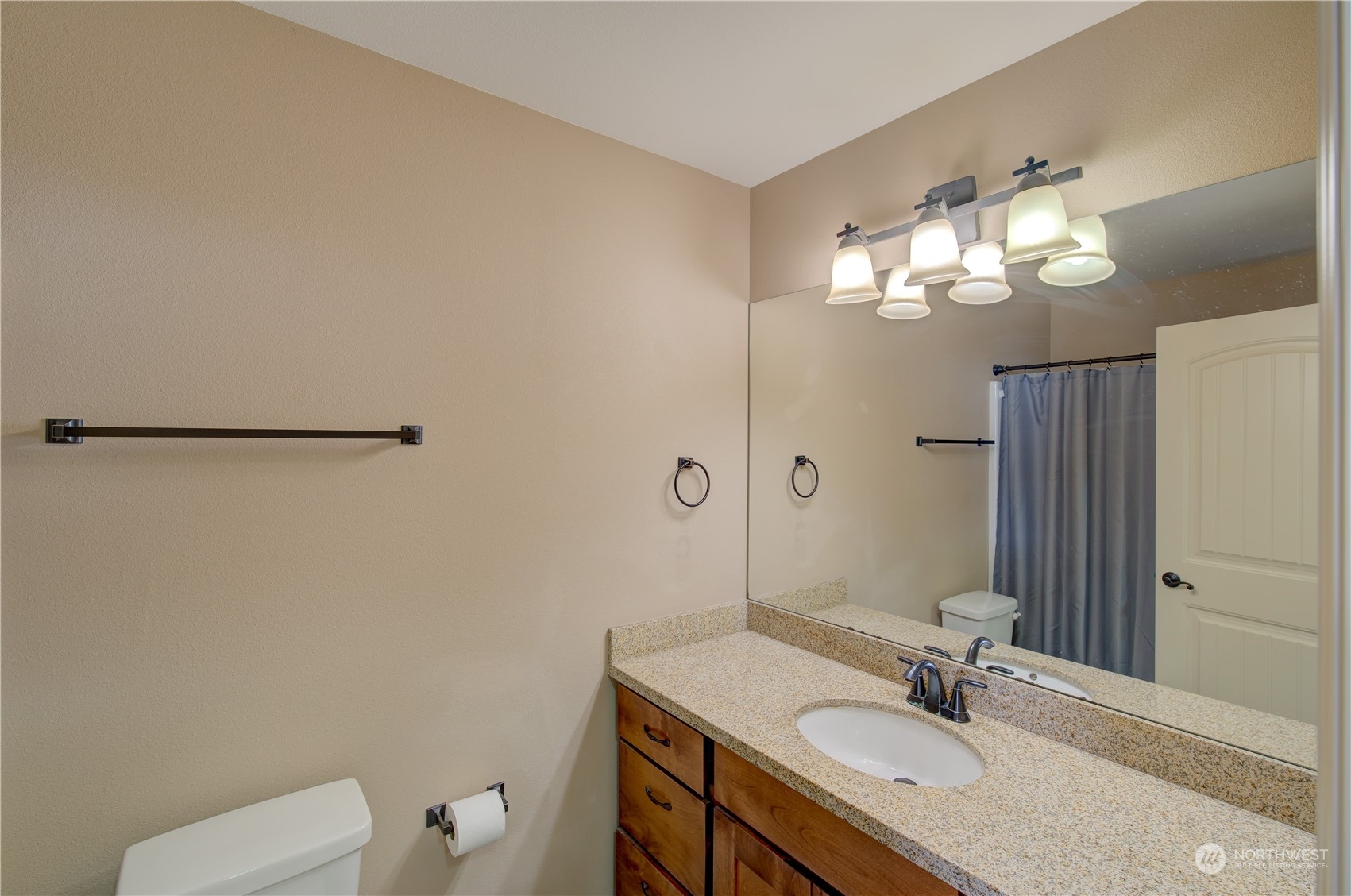206 Pioneer Road West Long Beach, WA 98631 - Photo 23 of 39 a bathroom with a granite countertop sink a toilet and a mirror